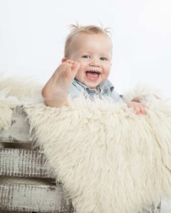 toddler has fun with her foot