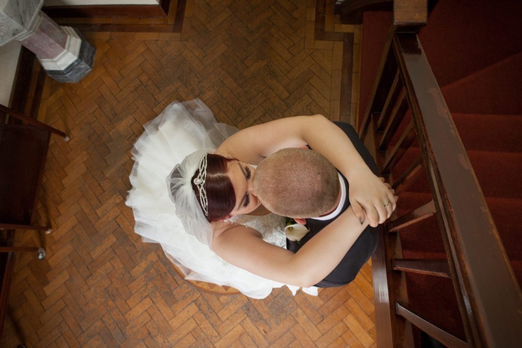 bride and groom give kisses