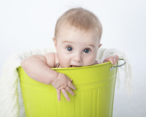 baby in a bucket