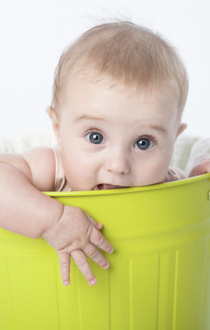newborn baby in a bucket