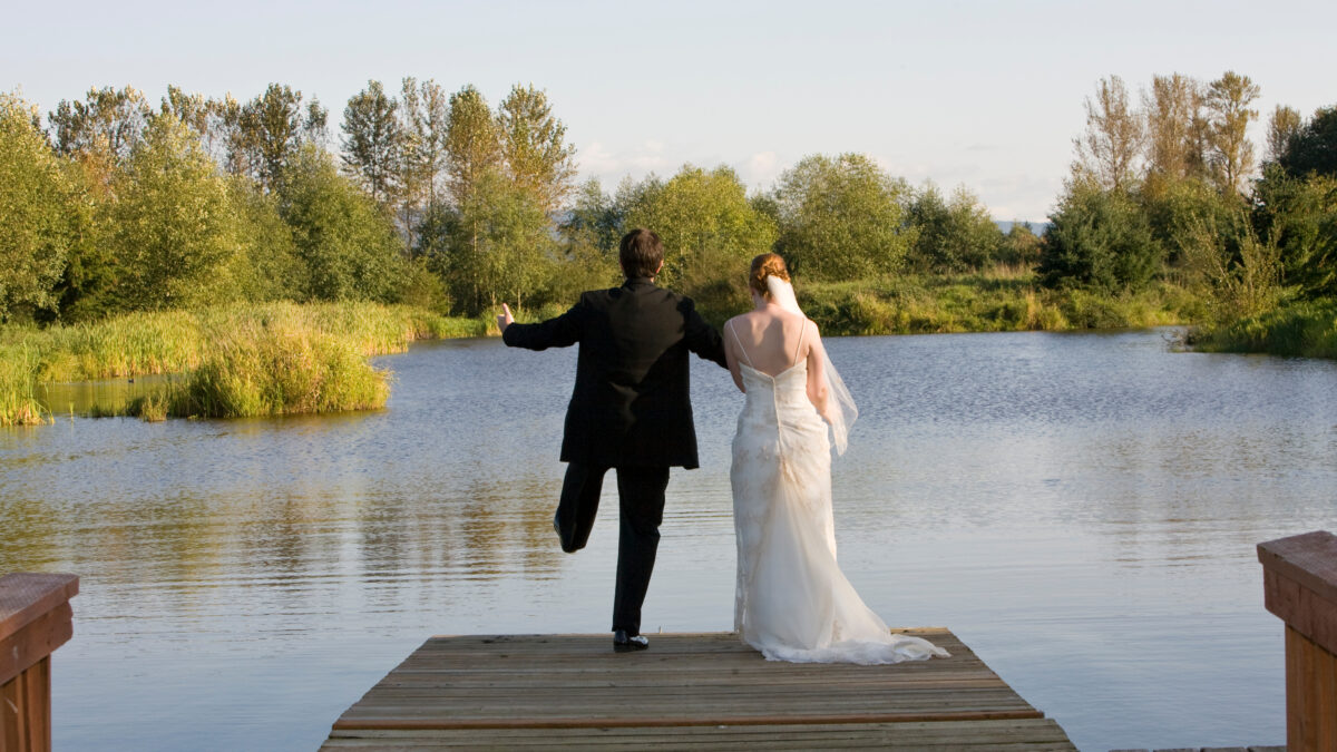 bride and groom jumping